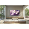SAMSUNG TQ65S99H TV OLED 65 pouces, vue de face écran mural avec barre de son dans salon épuré