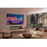 LG OLED77G6 TV OLED 77 pouces fixé au mur, salon contemporain avec écran affichant paysage nordique enneigé